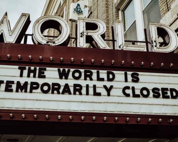 Theatre sign "The World Is Closed" | Photo by Edwin Hooper on Unsplash